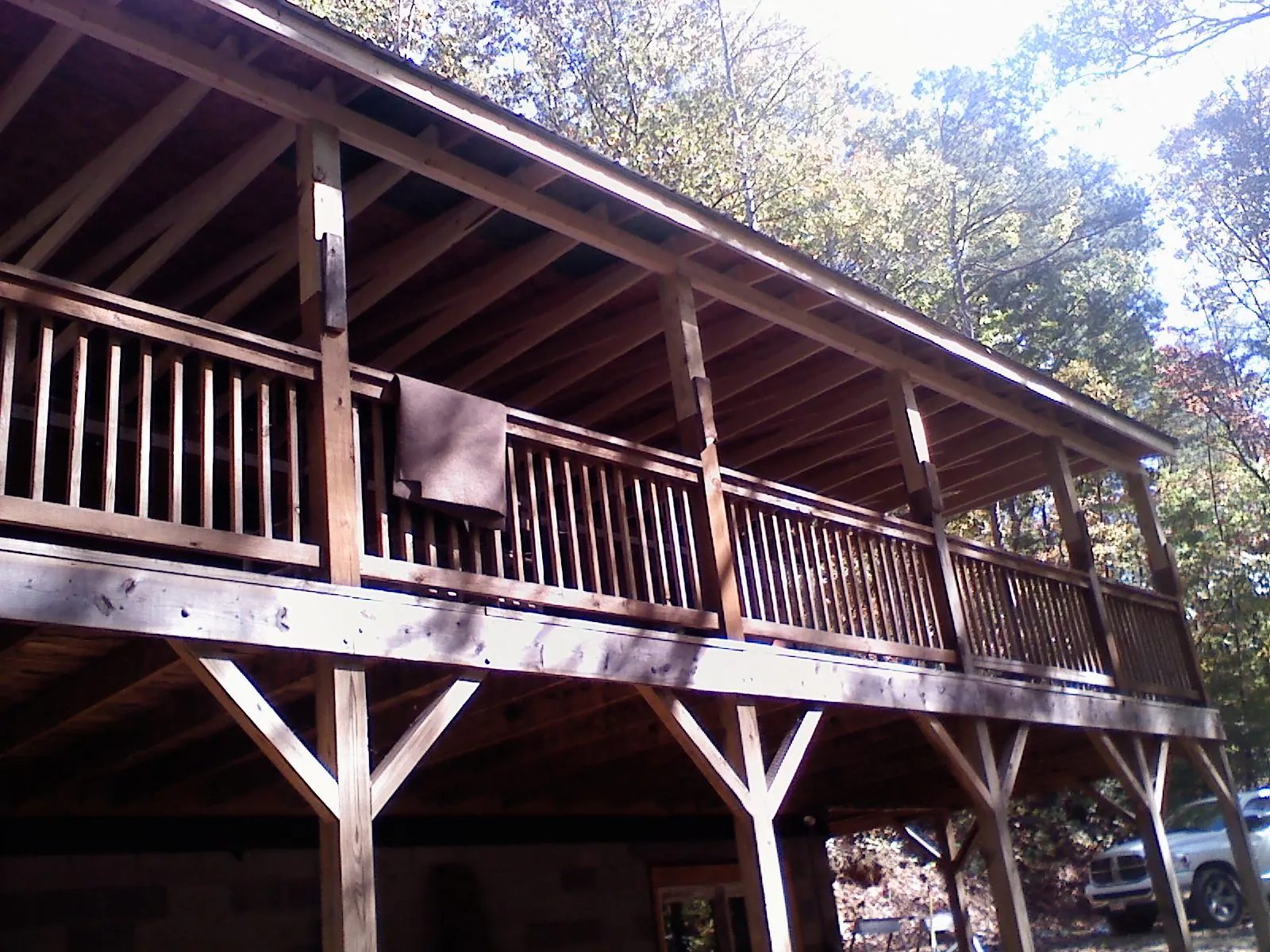 Timber framing under a new elevated porch and deck — Roof Leak Repair in Rogers by Roofing Brothers